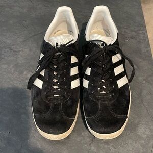 Adidas Gazelle size 8.5, black and white, worn but still in good condition.